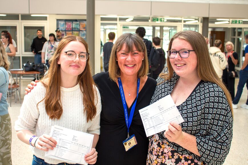 Director of Sixth Form with two students celebrating results
