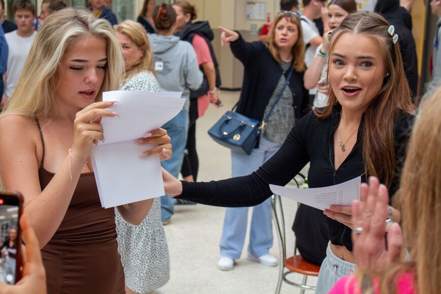 Two students celebrating opening their results