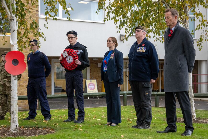 Photo of staff members and students at remembrance parade
