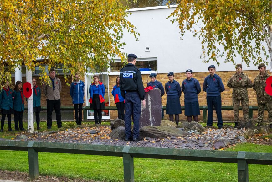 Photo of police cadet laying remembrance wreath
